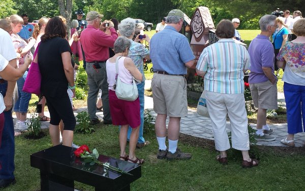 Families, friends and supporters of Parents of Murdered Children attend the dedication of the Memorial to Murdered Children in Augusta, ME. 
