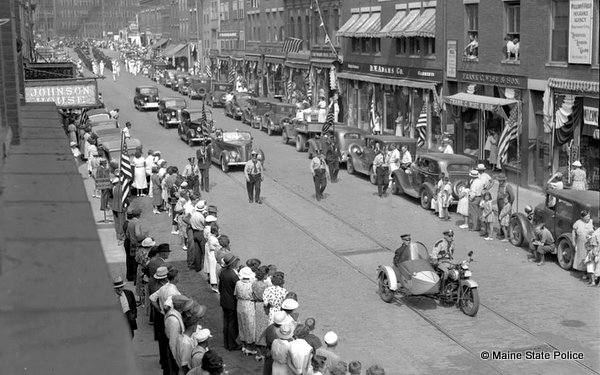 Parade in Maine circa 1940s with Maine State Police motorcycle with sidecar