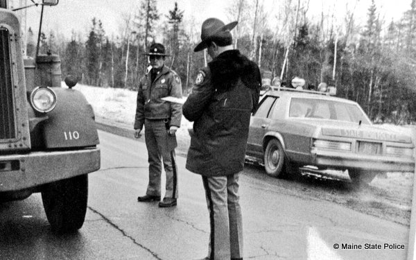 Dec. 1982-Maine Troopers Brian Theriault and Joe Doucette at safety checkpoint, US Rt. 1 Baring Township